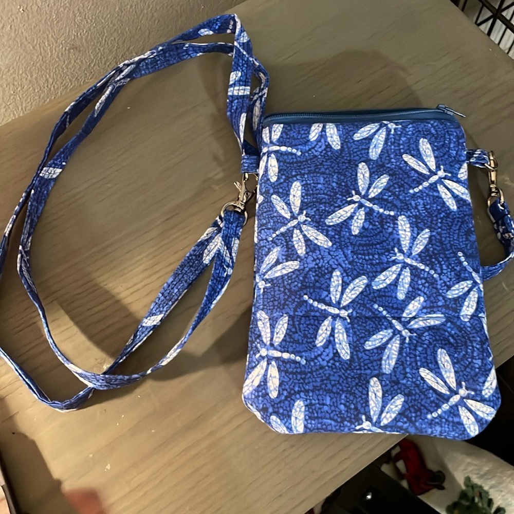 Blue wristlet purse.